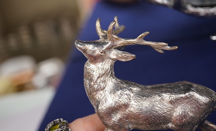 Five chrome and brass car radiator mascots; three in the form of stags’ heads, a stag standing on an oak branch and an Art Deco leading gazelle. Condition - fair, some losses to chrome plating.
